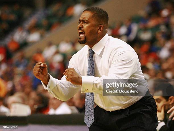 Head coach Frank Haith of the Miami Hurricanes tries to motivate his team against the Winthrop Eagles in the Orange Bowl Basketball Classic at Bank...