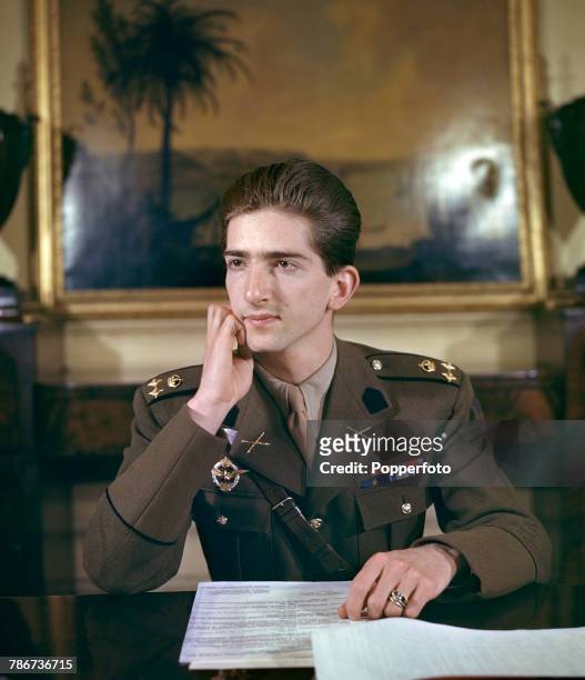 King Peter II of Yugoslavia pictured sitting at his desk in uniform during a period of exile in London in May 1943.