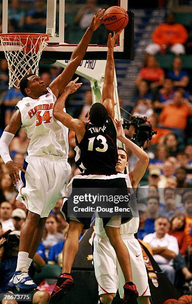 Mark Tyndale of the Temple Owls has a shot attempt blocked by Marreese Speights of the Florida Gators in the Orange Bowl Basketball Classic at Bank...