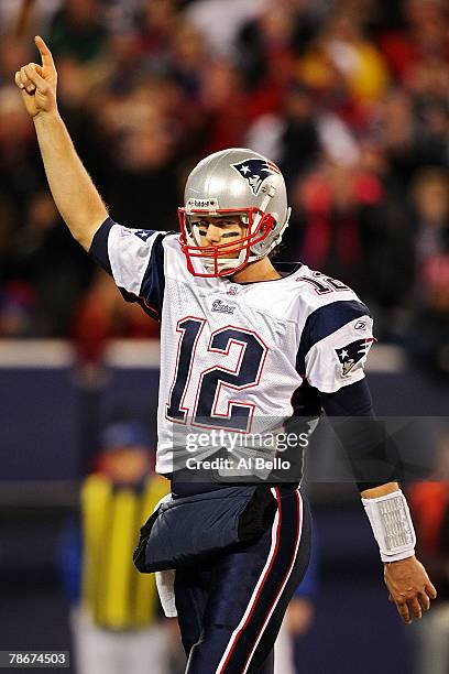 Tom Brady of the New England Patriots celebrates after converting the two point conversion against the New York Giants on December 29, 2007 at Giants...