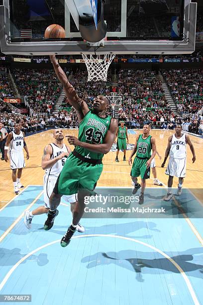 Kendrick Perkins of the Boston Celtics has an open layup in front of Carlos Boozer of the Utah Jazz at the Energy Solutions Arena December 29, 2007...