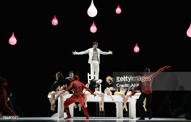 Faust, la symphonie en rouge et noir du chor?graphe Jean-Christophe Maillot". Dancers perform the ballet "Faust" directed by French choregrapher...