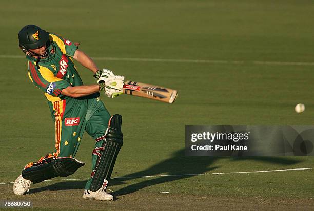 George Bailey of the Tigers hits out during the KFC Twenty20 Big Bash match between the Western Australian Warriors and the Tasmanian Tigers at the...