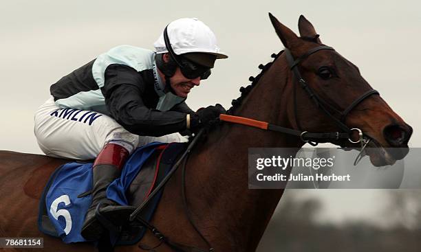 Richard Johnson and Presenting Copper clear the last fence to land The warwickracecourse.co.uk Beginners' Steeple Chase Race run at Warwick...