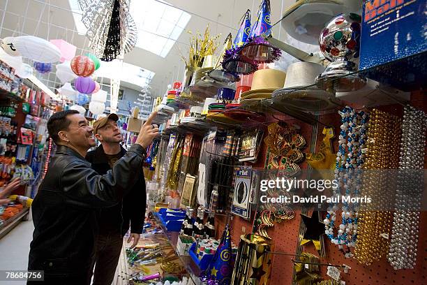Gilbert Mendez and Michael La Flash look over party favors as they shop for New Years Eve party favors at Cliff's Variety Store December 31, 2007 in...