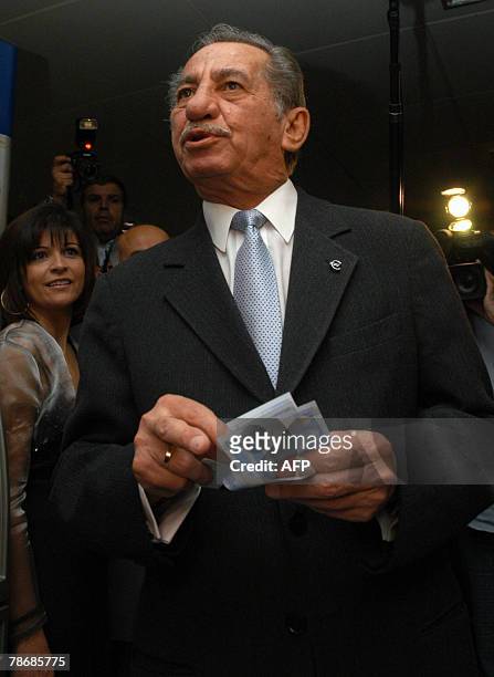 Cypriot President Tassos Papadopoulos speaks to the media after taking the first euro banknotes from an ATM machine at the finance ministry in...