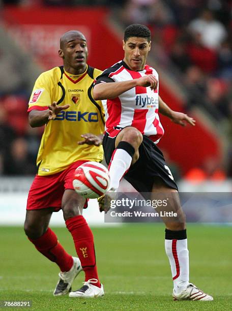 Southampton Captain, Youssef Safri is tackled by Damien Francis of Watford during the Coca-Cola Championship match between Southampton and Watford FC...