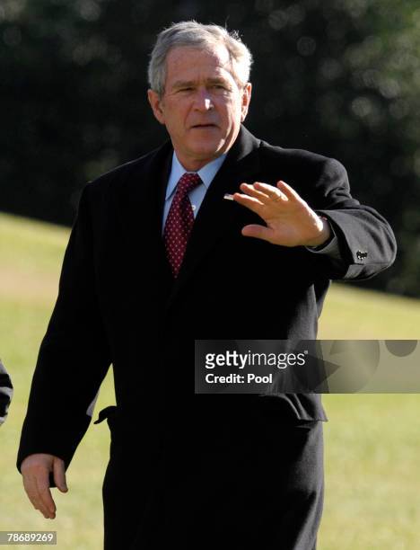 President George W. Bush waves as he returns to the White House January 1, 2008 in Washington, DC. Bush is returning after spending the holidays at...