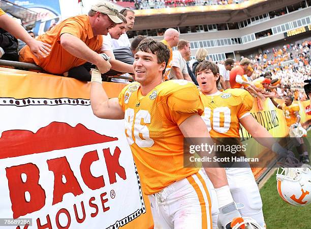 Tennessee Volunteers players Brad Cottam and Jeff Cottam celebrate after defeating the Wisconsin Badgers 21-17 at the Outback Bowl at Raymond James...