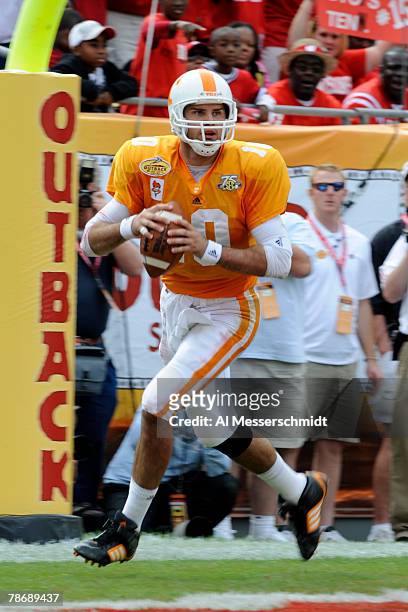 Quaarterback Erik Ainge of the Tennessee Volunteers sets to pass against the Wisconsin Badgers in the 2008 Outback Bowl at Raymond James Stadium on...