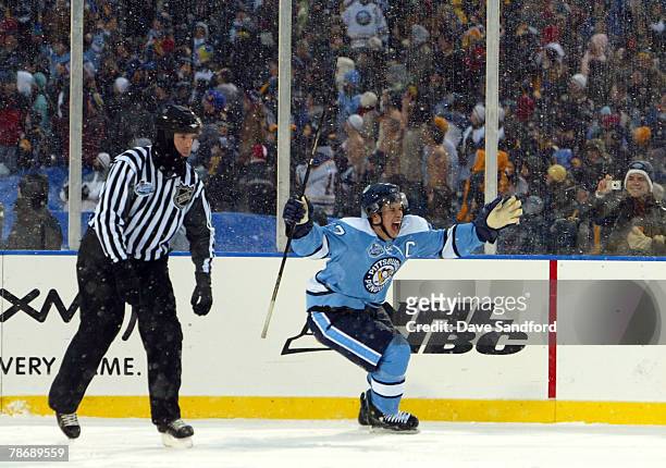 Sidney Crosby of the Pittsburgh Penguins celebrates his shoot out goal to win the NHL Winter Classic 2-1 over the Buffalo Sabres at the Ralph Wilson...