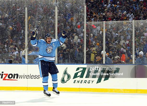 Sidney Crosby of the Pittsburgh Penguins celebrates his shoot out goal to win the NHL Winter Classic 2-1 over the Buffalo Sabres at the Ralph Wilson...