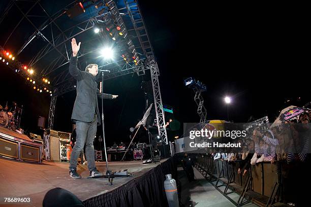 In this handout from Red Bull, Tom Delonge, of Angels and Airwaves, entertaines the crowd of the Red Bull Experiment at the Rio All Suite Hotel &...