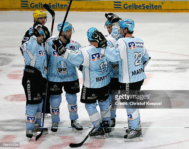 John Trip of the Freezers celebrates the second goal with his teammates during the DEL game between Koelner Haie and Hamburg Freezers at the...