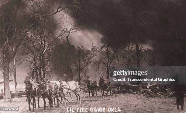 Postcard labelled 'Oil Fire Osage Okla.' shows three teams of horses and several men with pick-axes, while thick, black smoke billows about overhead,...