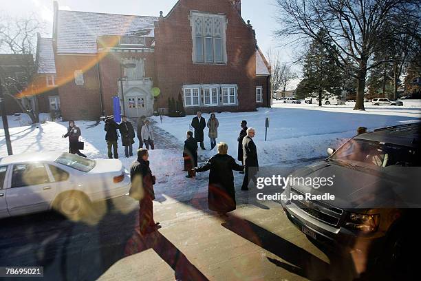 Democratic presidential candidate Sen. Hillary Clinton spreads her arms as she leaves an event at the First United Methodist Church January 2, 2008...