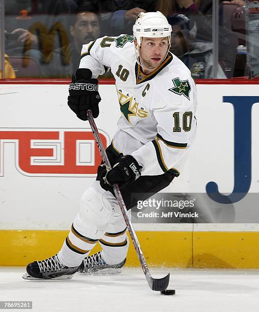 Brenden Morrow of the Dallas Stars skates up ice with the puck during their game against the Vancouver Canucks at General Motors Place on December...