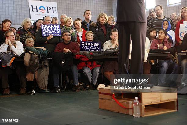 Democratic Presidential hopeful Senator Barack Obama speaks to voters from a makeshift soapbox-style podium during a rally at Friendly House...