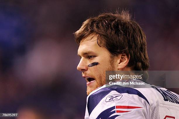 Tom Brady of the New England Patriots looks on from the sidelines against the New York Giants on December 29, 2007 at Giants Stadium in East...