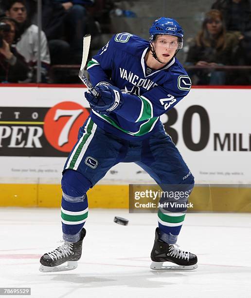 Alexander Edler of the Vancouver Canucks passes the puck during their game against the New Jersey Devils at General Motors Place on December 18, 2007...