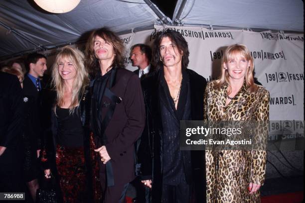 Married couples, from left, Teresa Barrick and Steven Tyler & Joe Perry and Billie Paulette Montgomery at the VH1 Fashion Awards October 23, 1998 in...