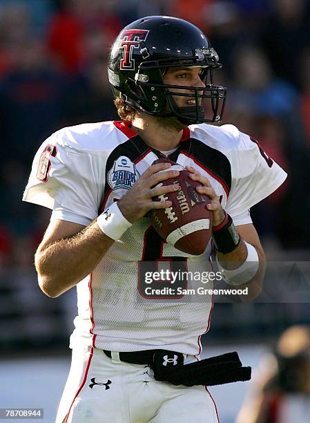 Graham Harrell of the Texas Tech Raiders drops back to pass during the Gator Bowl against the Virginia Cavaliers at Jacksonville Municipal Stadium on...