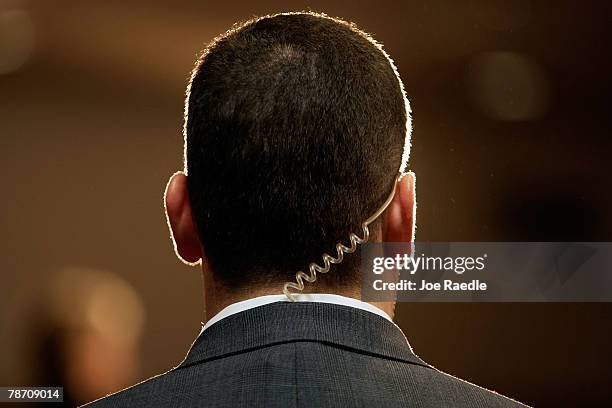 Secret service agent wears an earpiece as Democratic presidential candidate Sen. Hillary Clinton speaks during a campaign stop at the Mississippi...