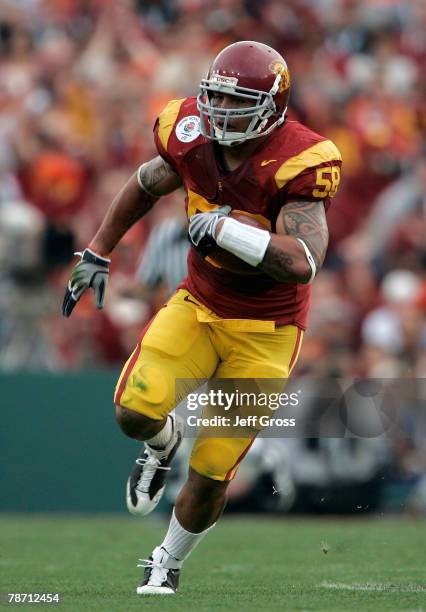 Rey Maualuga of the USC Trojans returns an interception against the Illinois Fighting Illini in the first quarter during the Rose Bowl presented by...