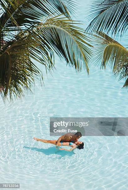 couple in shallow lagoon - lagoon stock-fotos und bilder