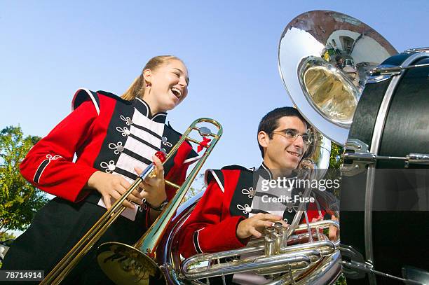 teenage girl and boy at band practice - marching stock-fotos und bilder