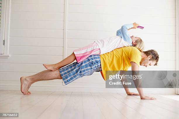 father giving daughter a ride - dad press ups kids stock pictures, royalty-free photos & images