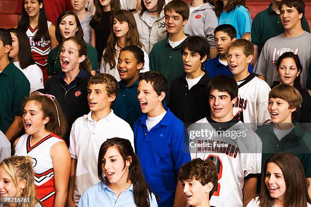 high school students singing in bleachers - african childrens choir stockfoto's en -beelden