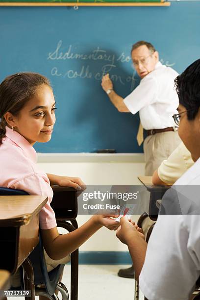 Passing Through Notes Passing Notes In School Photos and Premium High Res Pictures - Getty Images
