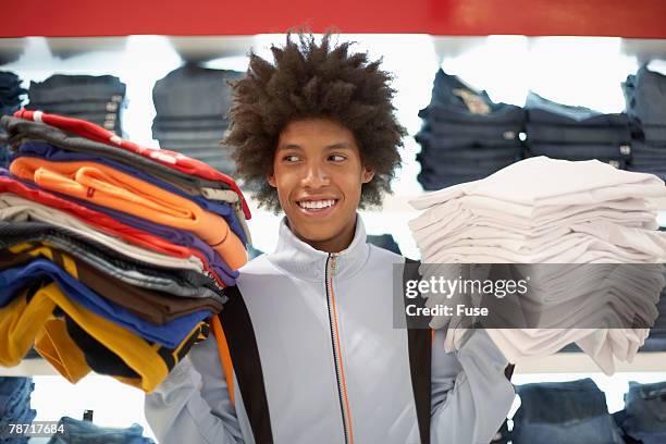 young man shopping - teenager boy shopping stock pictures, royalty-free photos & images