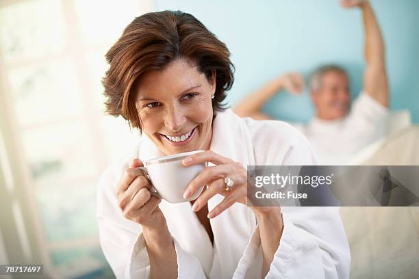 couple starting day - woman in bathrobe stock pictures, royalty-free photos & images