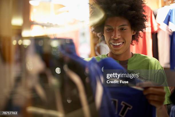 young man shopping - boy clothes stockfoto's en -beelden