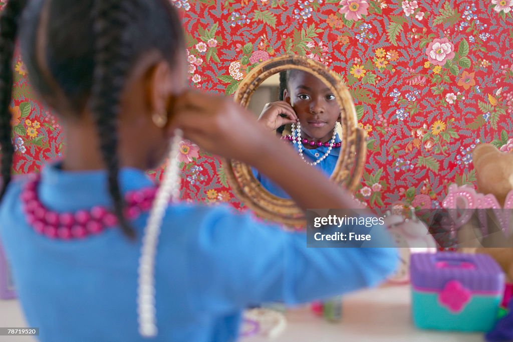 Girl Playing with Costume Jewelry