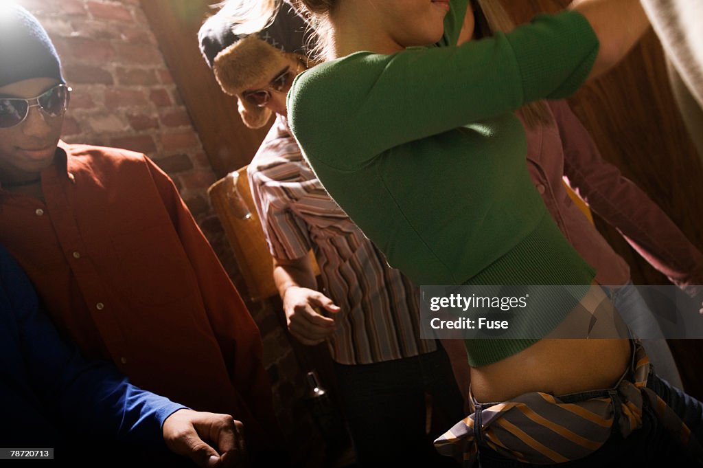 Young Adults Dancing At Nightclub