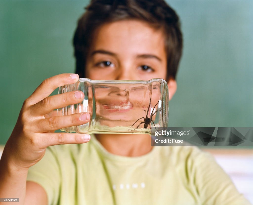 Schoolboy Holding a Jar with Spider