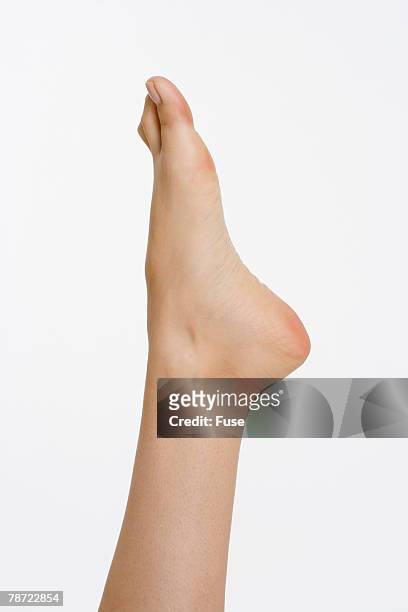 woman's foot - pointed foot stock pictures, royalty-free photos & images