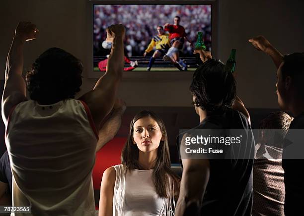 bored woman among sports fans - bored audience stock pictures, royalty-free photos & images