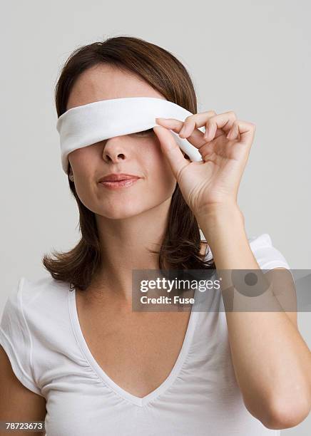 A Blindfolded Woman with Her Hands on Her Face · Free Stock Photo