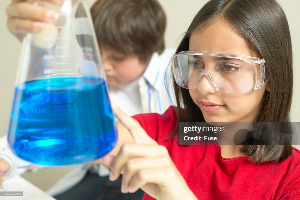 Young Science Student with Erlenmeyer Flask