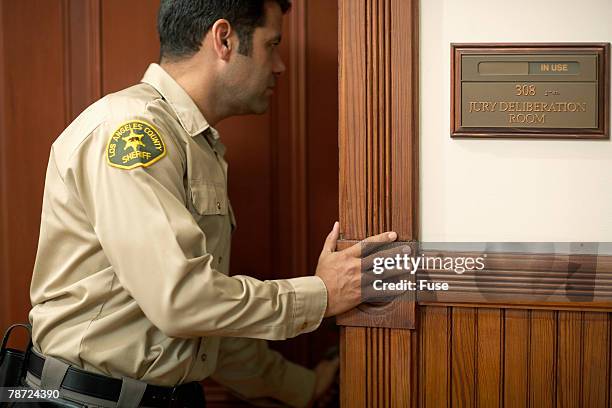 bailiff looking into jury room - bailiffs fotografías e imágenes de stock