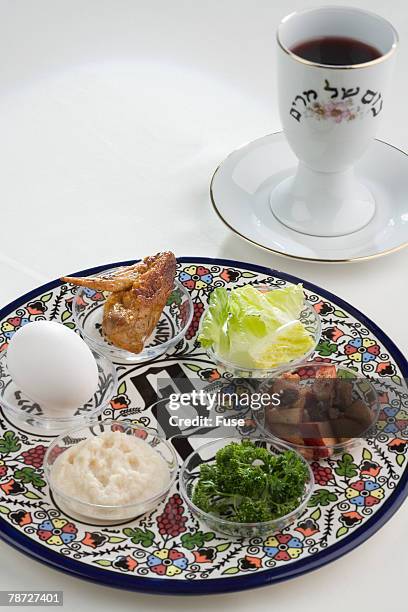 seder plate and cup - pesach seder stock pictures, royalty-free photos & images