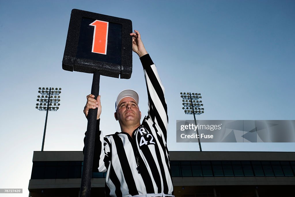 Referee Holding Down Marker