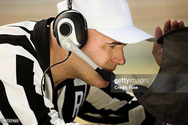 referee studying instant replay - american football on screen stock pictures, royalty-free photos & images