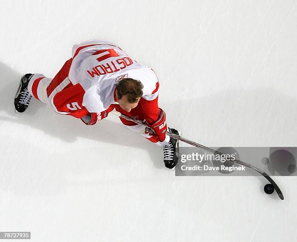 Nicklas Lidstrom of the Detroit Red Wings gets ready to take a shot during warmups before the NHL game against the St. Louis Blues on December 31,...