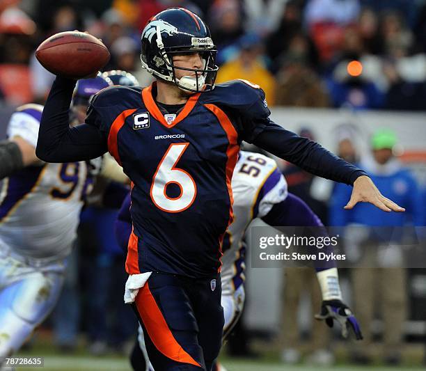 Quarterback Jay Cutler of the Denver Broncos sets to throw a pass during the football game against the Minnesota Vikings at Invesco Field at Mile...