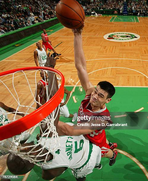 Yao Ming of the Houston Rockets shoots against Kevin Garnett of the Boston Celtics during the game on January 2, 2008 at the TD Banknorth Garden in...